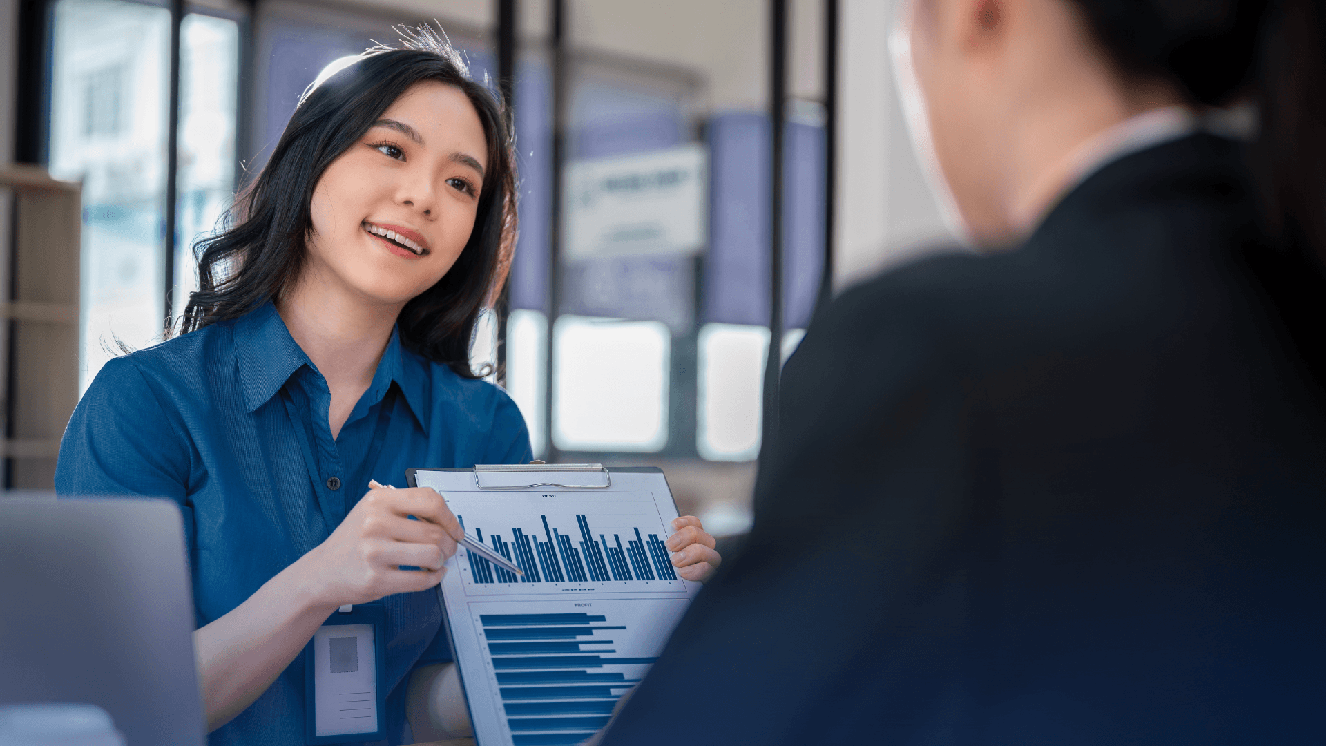 Sales manager using TACTIC GIS dashboard to view territory performance and AI-generated insights on a map